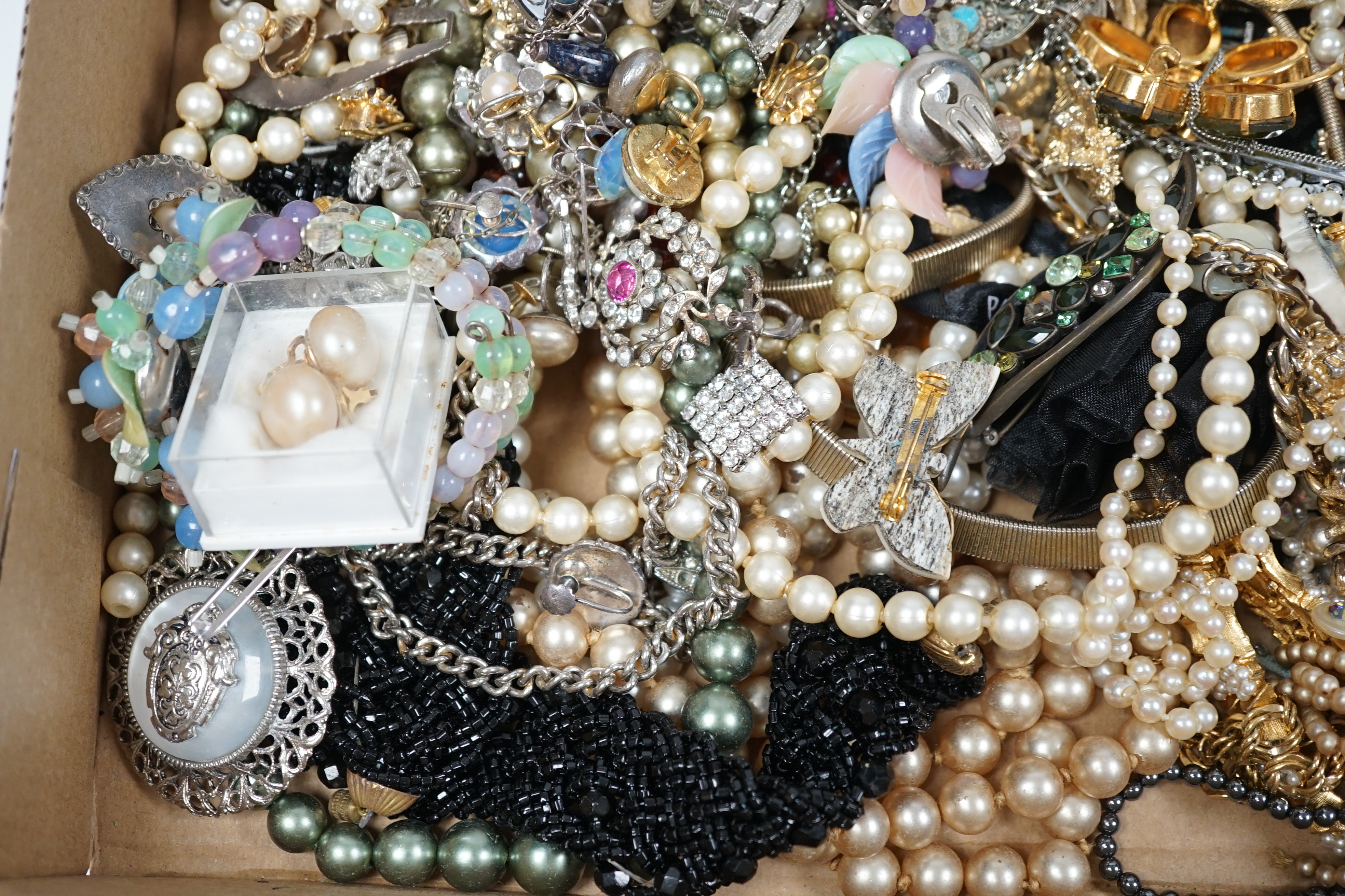 A quantity of assorted costume jewellery including cultured pearl necklace and rock crystal? cross pendant.